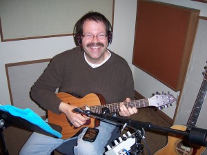 Keith Wilson laying studio guitar