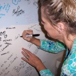 Carlene signs the Tesco Productions wall of fame