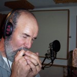 Phil Kleymann croons on the harmonica for Justin Michael.