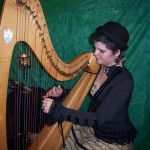 Grace rehearsing large harp.