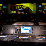 Home Instead Senior Care convention stage viewed from Tom Sharman's audio console mixing position.