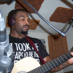 Mister Malachi lays acoustic guitar on Hip Hop, R&B tune