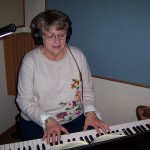 Deanna playing keyboard at Tesco Productions