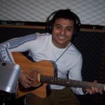 Acoustic guitar being played at Tesco Productions for Dipankar Bhaumik.