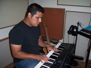 Isaias Rivera plays keyboard